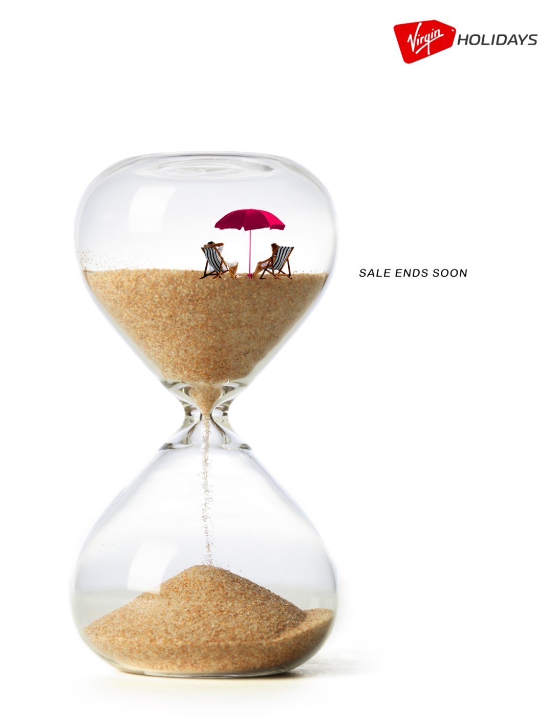 travel concept for a travel brand - sale ends soon - sand in an hourglass